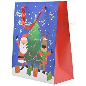 Zils papīra dāvanu maiss ar Ziemassvētku vecīša un koku apdruku ar lentes rokturiem 26+12x32cm